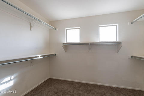 Primary closet with natural light