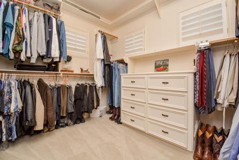 Primary closet is large and has built in storage