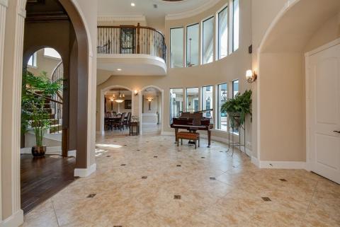 Huge formal entry. Room to the left is the study. From the windows, you get a full view of the pool which is located in the center of the home.