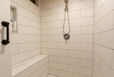 Double-sized tiled Shower with a custom bench
