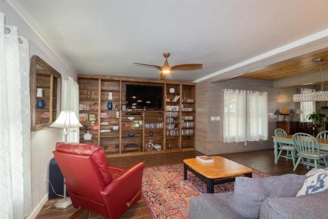 View of the Den with custom bookcase and entertainment space