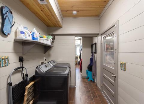 Utility Room right off the Kitchen with a swing period-type door and also leads to the tandem two-car garage and forward to one of the Master closets. Washer and Dryer are included.