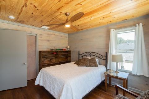 This is the perfect bedroom for the little ones with custom bookshelves for their little books and an adjoining bathroom with the most idyllic-sized tub.