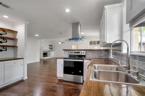 Lots of cabinets in this great kitchen!