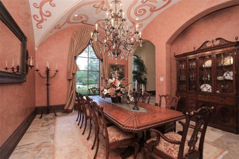 Extraordinary formal dining room that will accommodate your large dinner parties. Complete with a hand painted mural on the groin vaulted ceiling by an artist. Wood baseboards with decorative wood rope. Elegant chandelier for elegant dining with your guests! Extraordinary formal dining room that will accommodate your large dinner parties. Complete with a hand painted mural on the groin vaulted ceiling by an artist. Wood baseboards with decorative wood rope. Elegant chandelier for elegant dining with your guests!