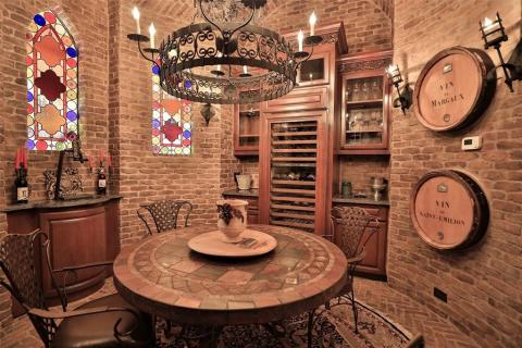 Climate controlled wine room with wine refrigerator, wine storage, brick walls, unique lighting, stain glass windows, & a room full of ambience for wonderful conversation with your guests! Climate controlled wine room with wine refrigerator, wine storage, brick walls, unique lighting, stain glass windows, & a room full of ambience for wonderful conversation with your guests!