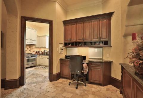 Ladies work station for bill paying or organizing recipes conveniently situated between the two kitchens . A view of the catering/service kitchen that is complete with a dishwasher, oven, & microwave. Ladies work station for bill paying or organizing recipes conveniently situated between the two kitchens . A view of the catering/service kitchen that is complete with a dishwasher, oven, & microwave.