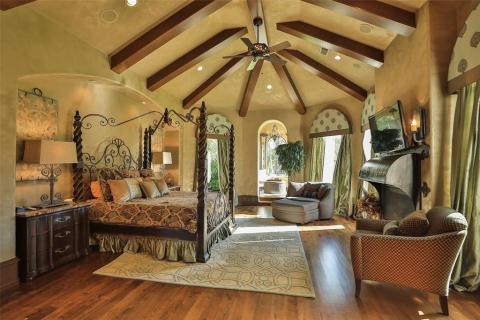 The master suite is complete with wood floors, unique wood beam ceiling, a cozy fireplace, private reading room, and surround sound. The master suite is complete with wood floors, unique wood beam ceiling, a cozy fireplace, private reading room, and surround sound.