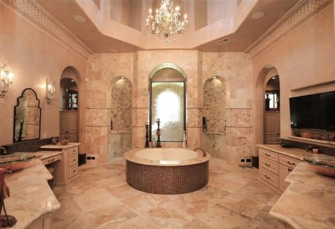 Luxurious spa like master bath complete with glass vessel sinks, sensational granite counters, vanity area for the Ladies, decorative crown molding & elaborate ceiling & chandelier. Soak in your round air bath while watching the soothing rain water window. Double entry walk in shower with overhead rain shower & hand held shower heads. Don't forget to notice the unique ceiling! Luxurious spa like master bath complete with glass vessel sinks, sensational granite counters, vanity area for the Ladies, decorative crown molding & elaborate ceiling & chandelier. Soak in your round air bath while watching the soothing rain water window. Double entry walk in shower with overhead rain shower & hand held shower heads. Don't forget to notice the unique ceiling!