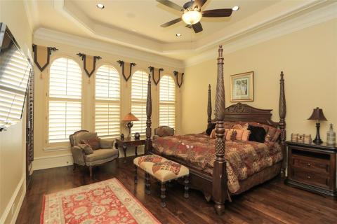 Guest room that features gorgeous wood floors, tray ceiling, double crown molding, plantation shutters, & cam lighting. Complete with own bath for convenience! Guest room that features gorgeous wood floors, tray ceiling, double crown molding, plantation shutters, & cam lighting. Complete with own bath for convenience!