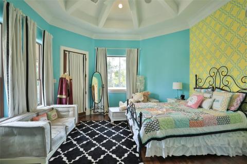 Secondary bedroom features private bathroom & loft area with built-in desk & shelves for your own homework nook. Amazing ceiling, wood floors, & door that leads to the balcony & outdoor living area. Secondary bedroom features private bathroom & loft area with built-in desk & shelves for your own homework nook. Amazing ceiling, wood floors, & door that leads to the balcony & outdoor living area.