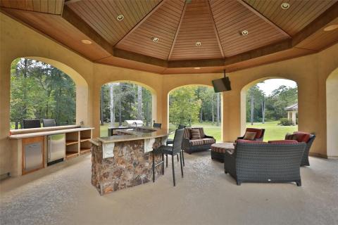 Another large Gazebo that features an outdoor kitchen, living area, TV and 1/2 bath. Complete with two bar seating areas, mini refrigerator, cam lighting, and perfect place to entertain your guests! Another large Gazebo that features an outdoor kitchen, living area, TV and 1/2 bath. Complete with two bar seating areas, mini refrigerator, cam lighting, and perfect place to entertain your guests!