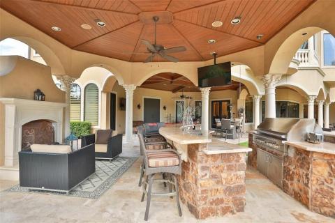 Large Gazebo that has an outdoor kitchen and living area off the covered patio. Complete with an outdoor fireplace, gorgeous stone bar with granite counters, TV, surround sound, & cam lighting! Large Gazebo that has an outdoor kitchen and living area off the covered patio. Complete with an outdoor fireplace, gorgeous stone bar with granite counters, TV, surround sound, & cam lighting!