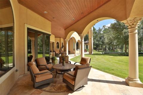 One of the covered patios in this sprawling estate! Massive decorative columns & arches, wood tongue & groove ceiling, and cam lighting are featured in this lovely covered patio. One of the covered patios in this sprawling estate! Massive decorative columns & arches, wood tongue & groove ceiling, and cam lighting are featured in this lovely covered patio.
