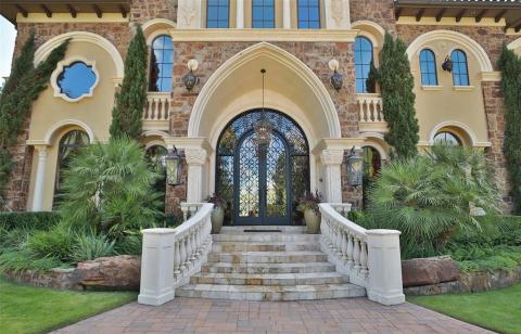 Dramatic elevated entry welcomes your guests in style! The elegant Tuscan style scrolled wrought door is simple amazing! Dramatic elevated entry welcomes your guests in style! The elegant Tuscan style scrolled wrought door is simple amazing!