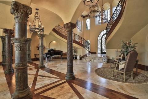 Stunning antique & ornate columns, groin vaulted ceilings, travertine floors with inlay wood, lighted steps from the entry to the living room, lighted art niches and gorgeous light fixtures are featured in this remarkable Grand Estate. Stunning antique & ornate columns, groin vaulted ceilings, travertine floors with inlay wood, lighted steps from the entry to the living room, lighted art niches and gorgeous light fixtures are featured in this remarkable Grand Estate.