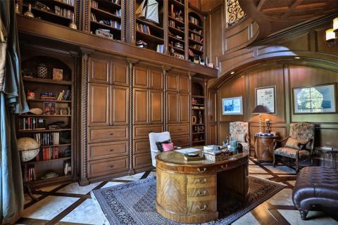 Two story stately study with elaborate & custom millwork, travertine with inlay wood floors, block paneling, surround sound, plenty of storage for your home office needs. Two story stately study with elaborate & custom millwork, travertine with inlay wood floors, block paneling, surround sound, plenty of storage for your home office needs.