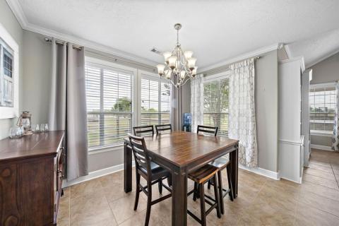 Breakfast Table area, but its so spacious it could be it's own dinning area with views that make this home one you do not want to pass up!!