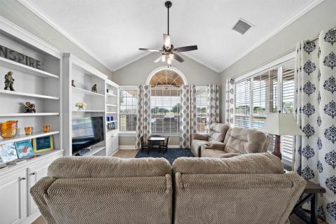 This comfortable yet spacious Family room is right off the kitchen, and it provides an array of windows to let you admire every picturesque view this home has to provide!