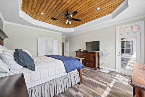 Another view of the Primary bedroom with access to the pool and back yard.