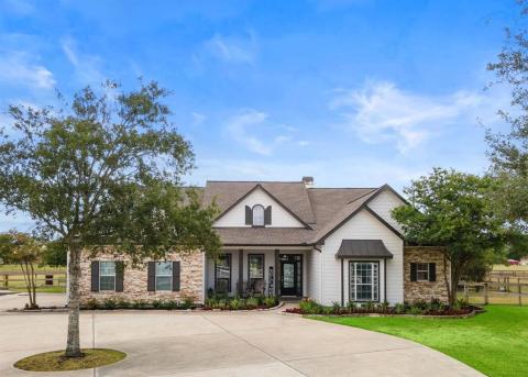 Beautiful landscaping, and the nice large Front porch accenturates this Gorgeous Home!