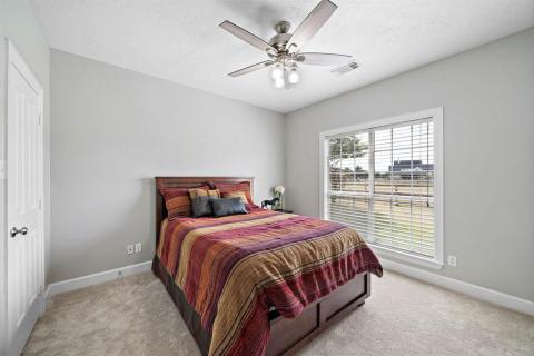 This secondary bedroom with a Queen size bed has room to keep adding furniture! Another room with a view, as well!!
