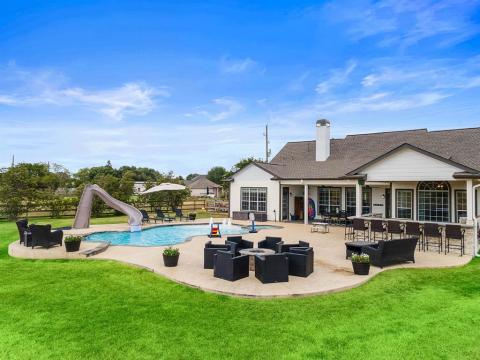 A view of the Fire Pit, the counter bar space of the outdoor kitchen, and a view of this outdoor oasis!!