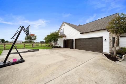 A Three Car Garage and space to work out, or ball a game of basketball