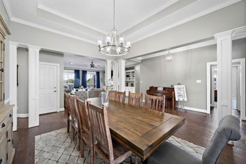 View of the entry way with glimpses of other parts of the home from the formal dinning room.