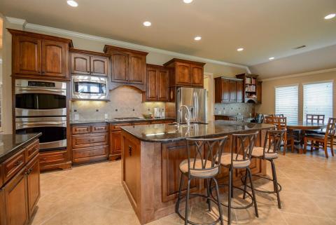 Stainless steel appliances add to the shine in this winning space. Big windows, right, provide great light in the breakfast nook and surrounding areas.