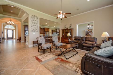 The beauty of an open floor plan provides this expansive view from front entry to living area.