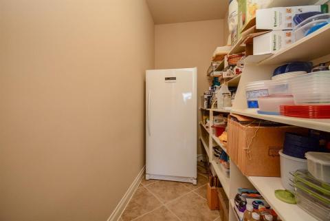 This is one of two pantries, big enough to accommodate another refrigerator/freezer.
