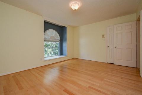Simle luxury is all in the details, with this darling recessed, floor-to-ceiling secondary bedroom. Wood flooring appears in all secondary bedrooms.