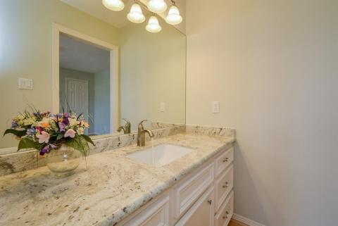 More lush bathroom features with tranquil colored appointments.