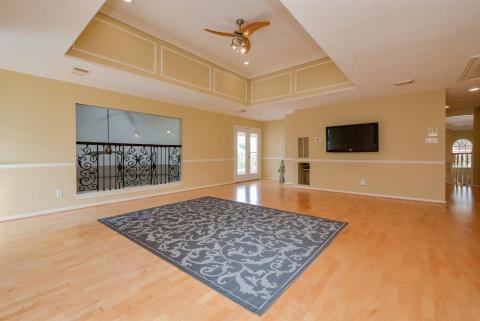 It's no surprise that this sparkling gameroom on the 2nd level is prepared to host fun and entertaining.! This precious tray ceiling is a welcomed addition, here, with bright patio doors accessing a large, outdoor balcony with a perfect lake view; and a darling Juliet balcony overlooking the casual living/family area. (We hope Romeo shows up.).