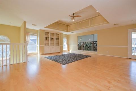 Isn't this a divine view, at the top of the staircase, taking in outside balcony, built-in shelving and space galore?