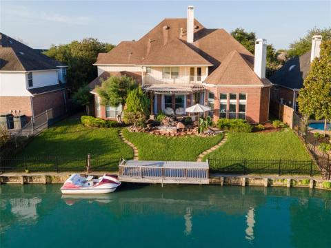 Some folks say that where there is water, there's peace. We're sold! There's a composite backyard deck with boat and electrical outlets for your sailing and drifting pleasure; with rod iron ? wrought iron? fencing surrounding the majority of the property.