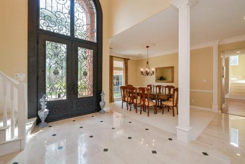 Heavenly high, vaulted ceilings offer a visual impression of even more space! Wide open purposed common areas can be as private or shared as you like. It's all up to you. One example of the benefits and versatility of the open floor plan design concept is that you're in charge of exactly where you place what. This regal formal dining area is an example.
