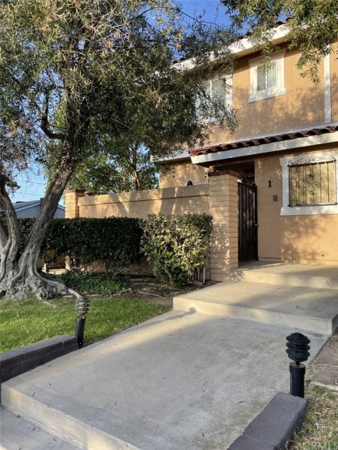 Entrance to front door through gated courtyard.