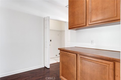 Upstairs Double Cabinetry At Top Of Stairwell Hall Looking Toward Indoor Laundry Room