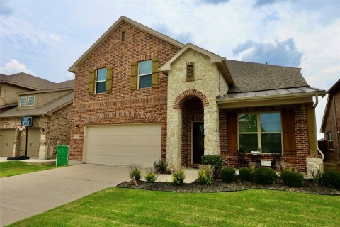 As you admire the home from the driveway, the architectural details catch your eye. The exterior facade showcases a combination of stylish materials such as stone, and brick, adding character and visual interest. The windows, adorned with decorative shutters, provide an elegant touch and contribute to the home's overall charm.