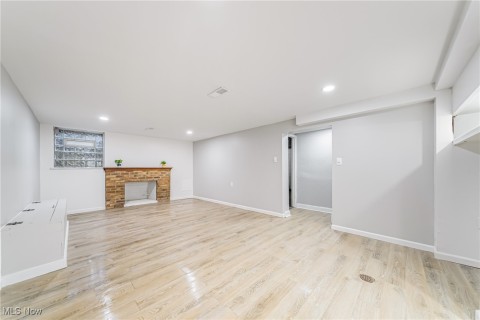 Finished Basement Rec Room with fireplace and Flooring