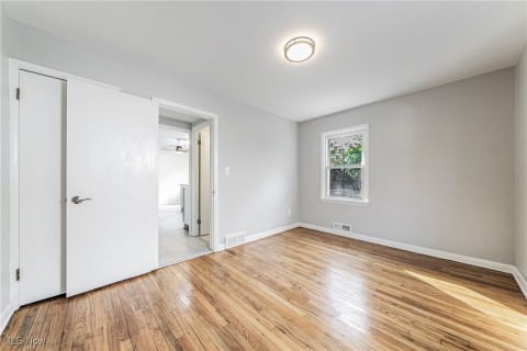 Spare room featuring  hardwood flooring