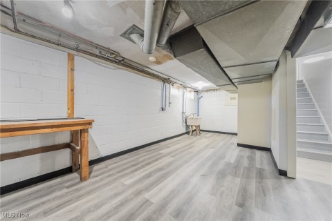 Basement with sink and light LVT Flooring