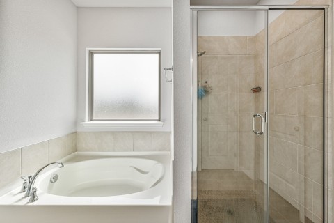 Bathroom featuring independent shower and bath
