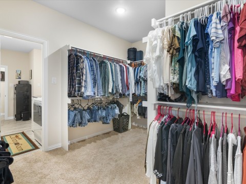 Spacious closet with access to laundry room