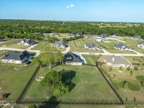 View of back yard featuring fence and a rural view of subdivision