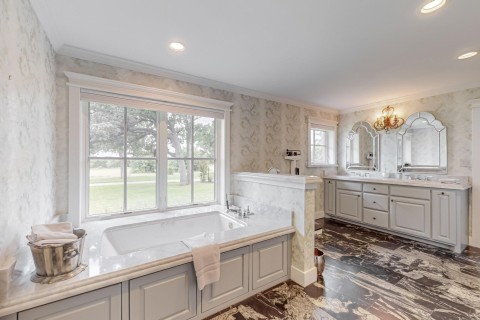 Primary bathroom view 2 Jacuzzi tub, Carrara marble countertops