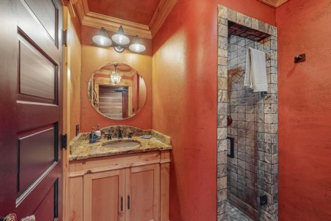 Bathroom 2 Kohler fixtures, Knotty alder cabinets and trim, full onyx shower