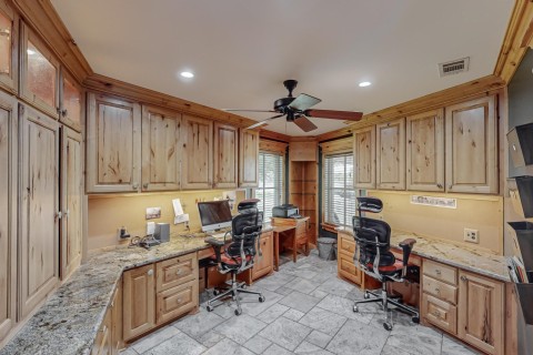 Home office Knotty Alder cabinets, Custom granite dual work stations, recessed lighting and display cabinet lighting, fiber optic internet